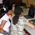 students controlling computer